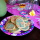 A plate of sugar cookies on a party plate