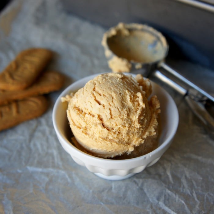A scoop of pumpkin cheesecake ice cream in a white bowl