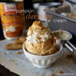 Two scoops Pumpkin Cheesecake ice Cream in a bowl topped with whipped cream