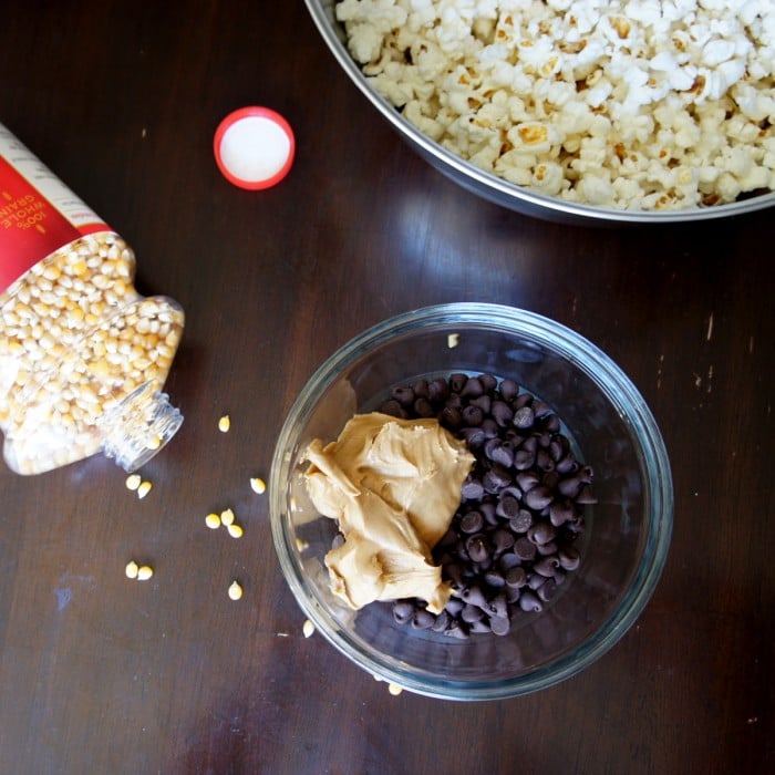 Peanut butter added to a bowl of chocolate chips