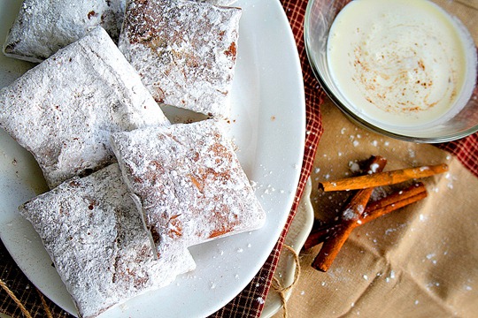 A close up of Pumpkin Bourbon French Beignets on a plate