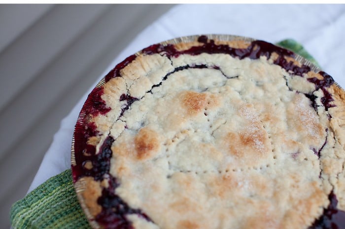 A close up of  the top of a Huckleberry Pie.