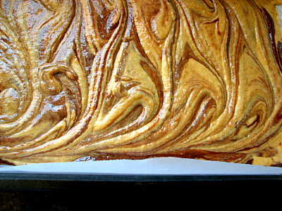 A close up of Chocolate Pumpkin Swirl Brownies in a pan