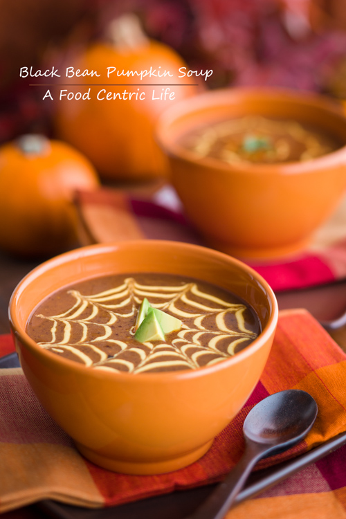 A bowl of soup with a spider web pattern on top