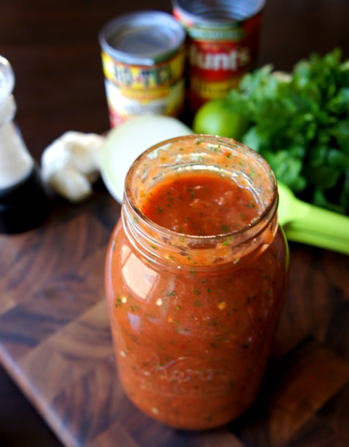 A mason jar of salsa on a table