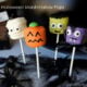 A display of Halloween themed marshmallow pops - mummy, pumpkin, Frankenstein and a vampire