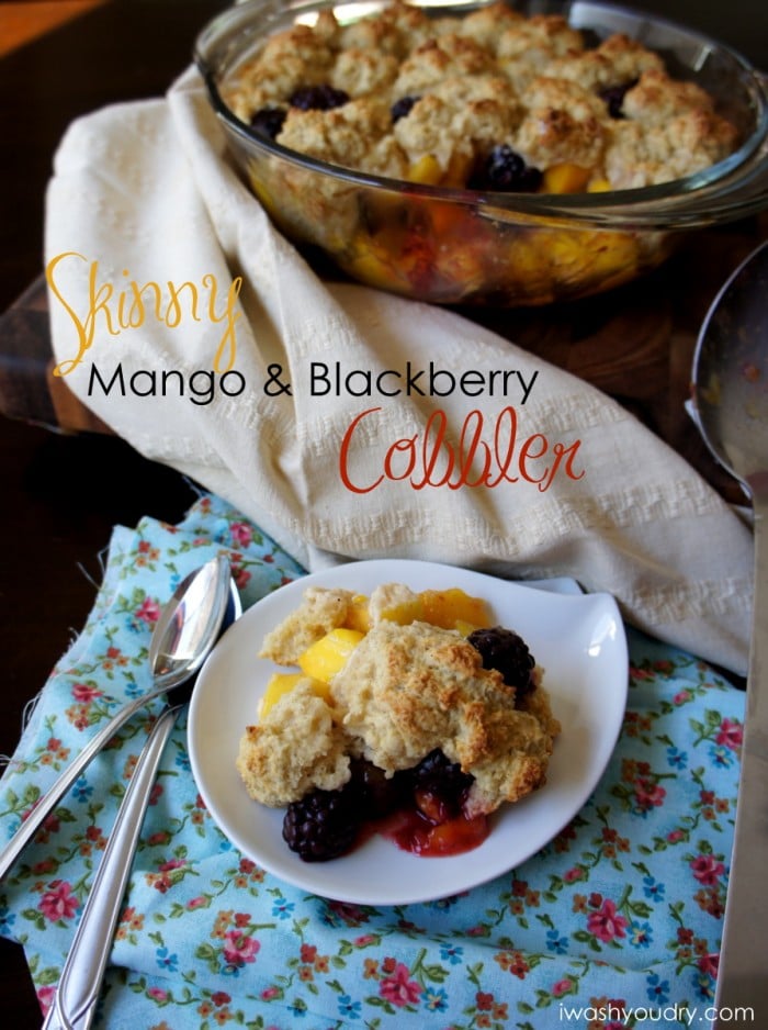 A display of cobbler on a plate with the title \"Skinny Mango & Blackberry Cobbler\"
