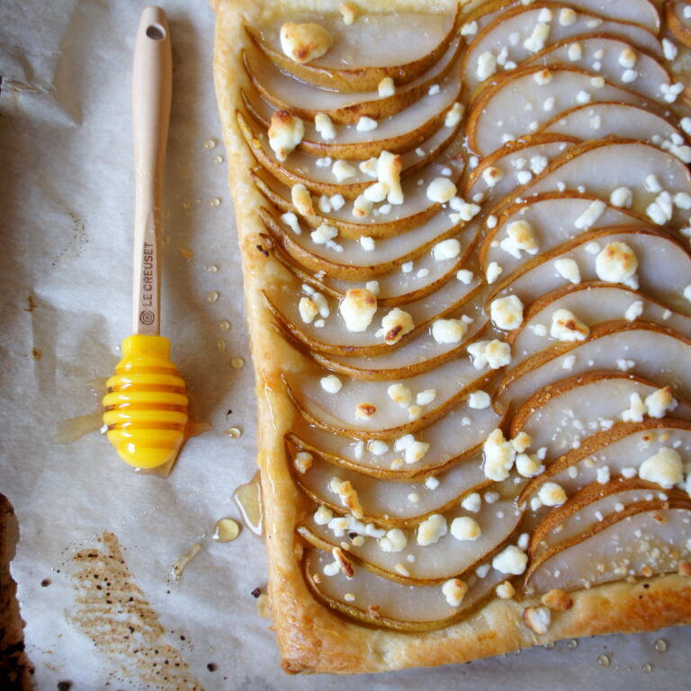 A close up of Pear, Goat Cheese and Honey Tart on a pan
