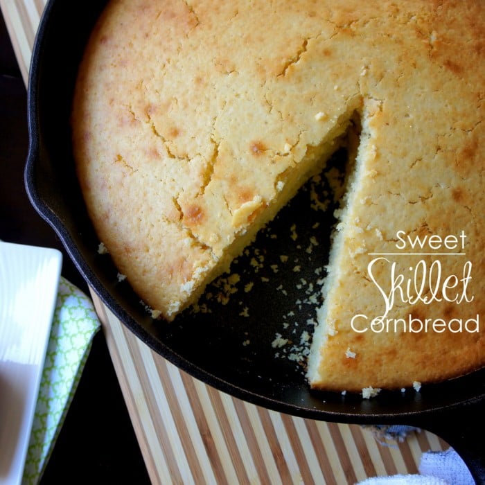 A close up of a pan of Sweet Skillet Cornbread with a slice removed