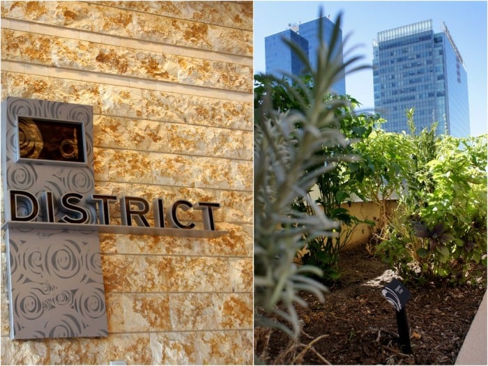 The sign for a fancy restaurant called \"the District\" where the dishes are focused on classic American comfort food with a twist