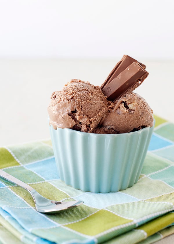 Two scoops of Kit Kat ice cream in a bowl on a table