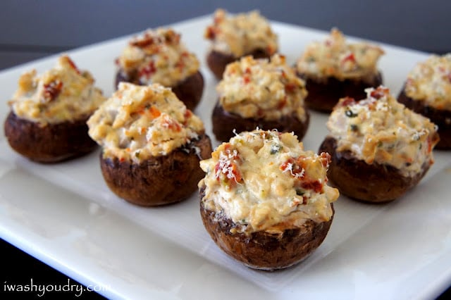 A close up of a plate of stuffed mushrooms 