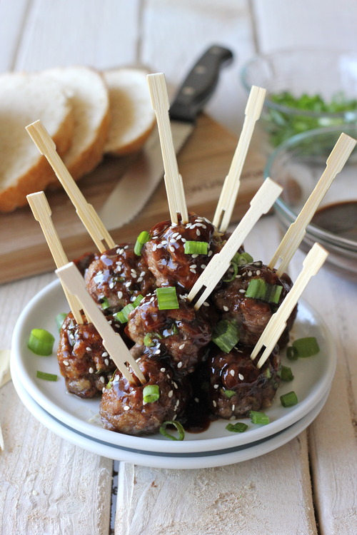 A pile of meatballs with brown sauce on a plate 