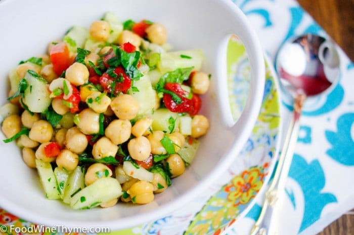 A close up of a bowl of salad with chickpeas