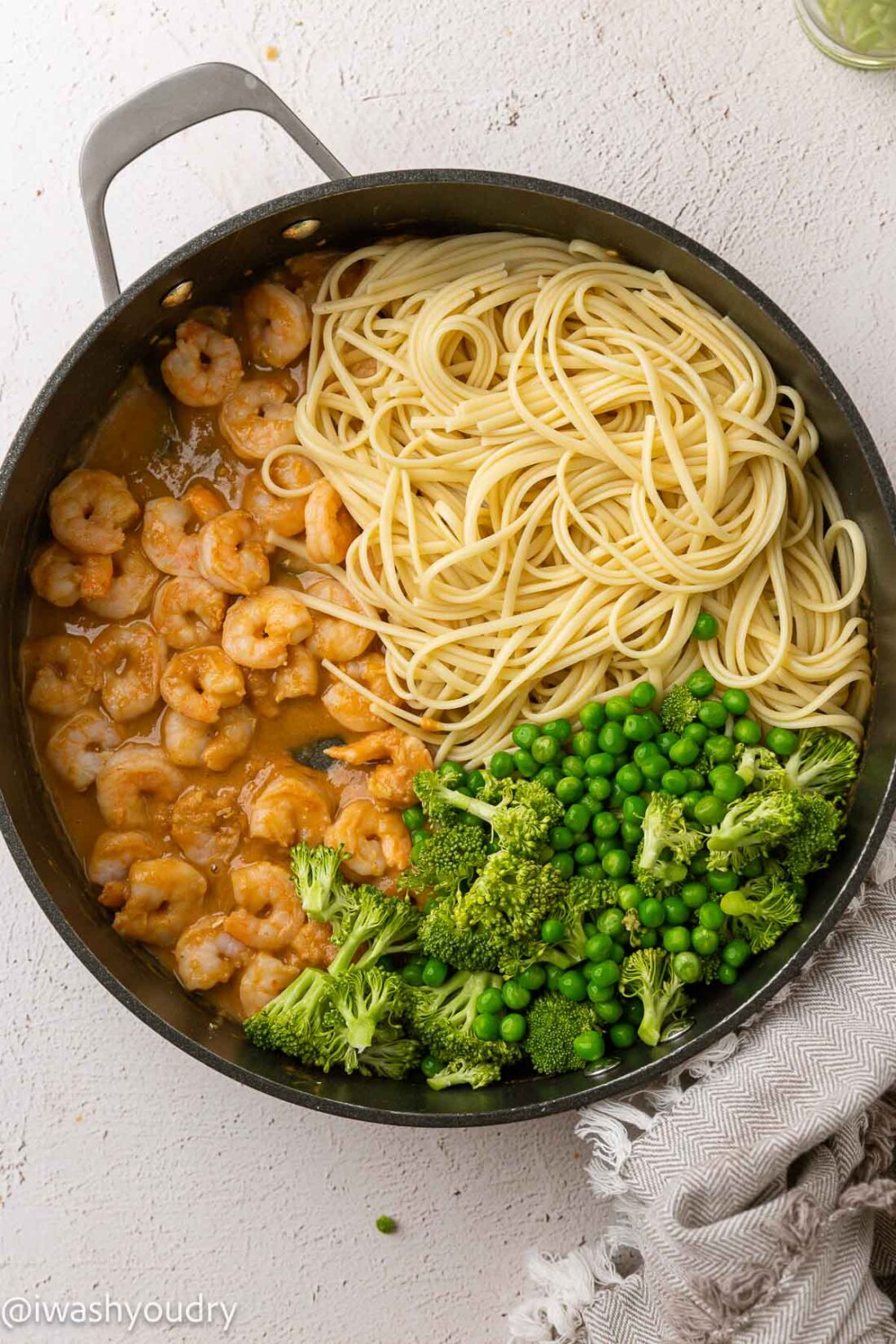 shrimp stir fry with noodles and broccoli in peanut sauce.