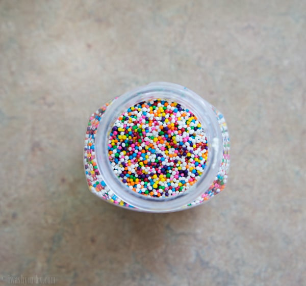 Looking down on a glass jar of sprinkles