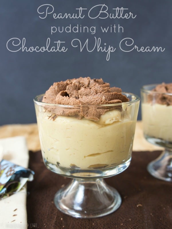 A clear glass dessert cup with Peanut Butter Pudding topped with chocolate whip cream