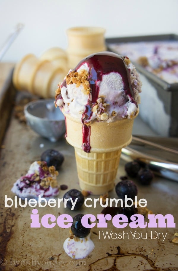 ice cream cone with scoop of blueberry ice cream and oat crumble.