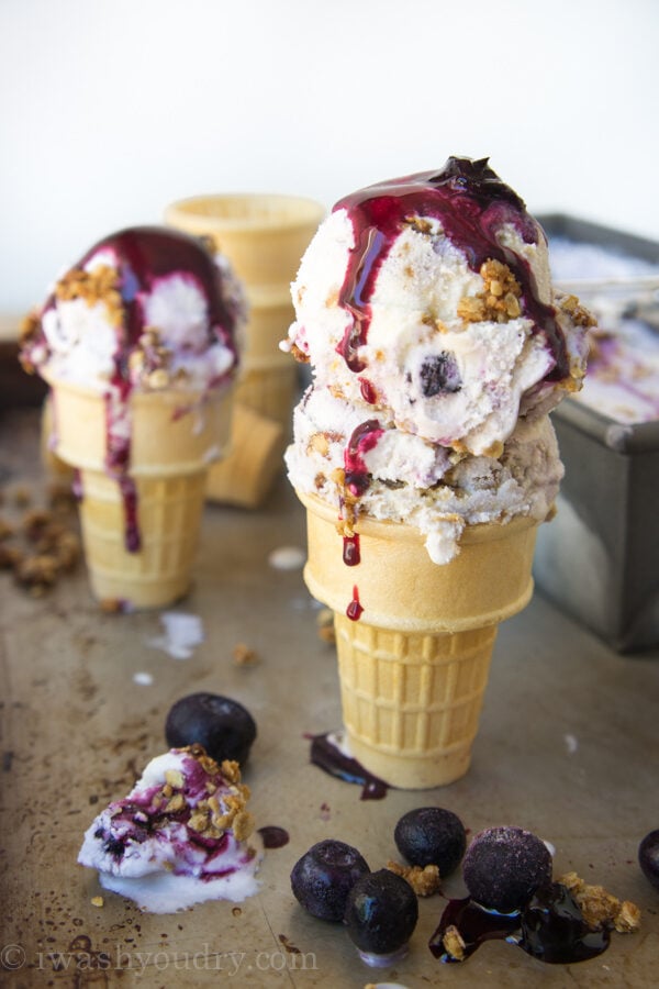 scoops of blueberry ice cream in cones.