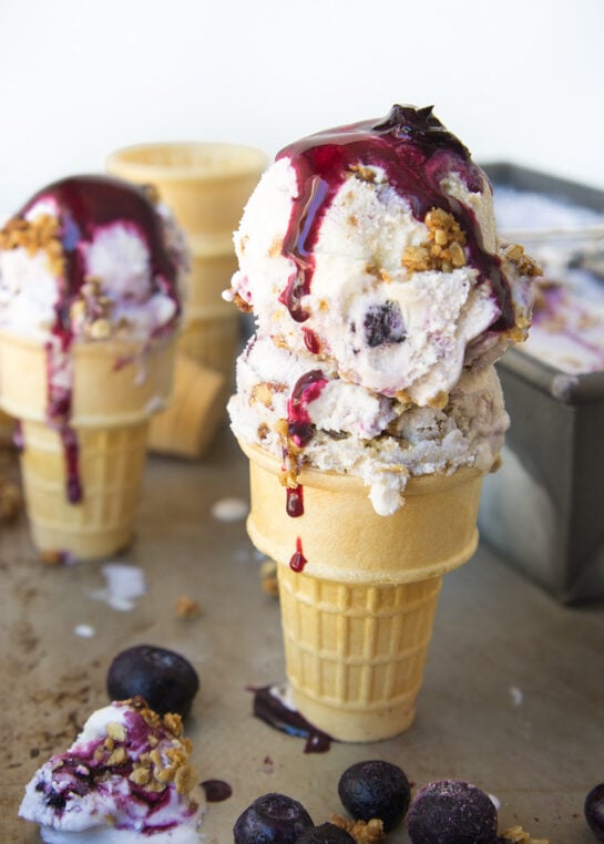 scoops of blueberry ice cream in cones.