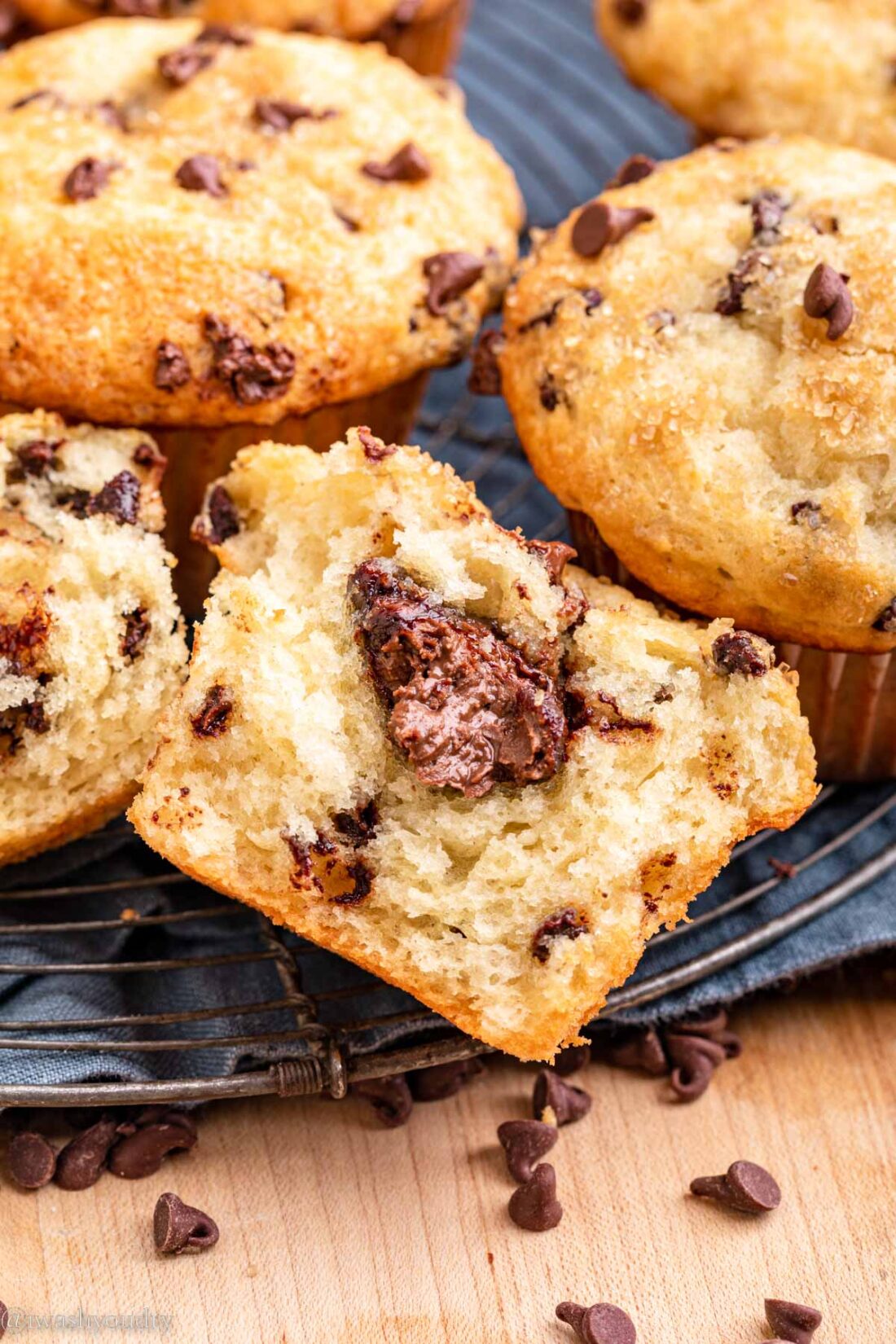 Baked nutella chocolate chip muffin on dish towel. 