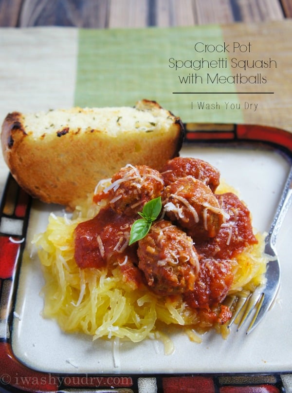 plate of spaghetti squash with meatballs and sauce on top.
