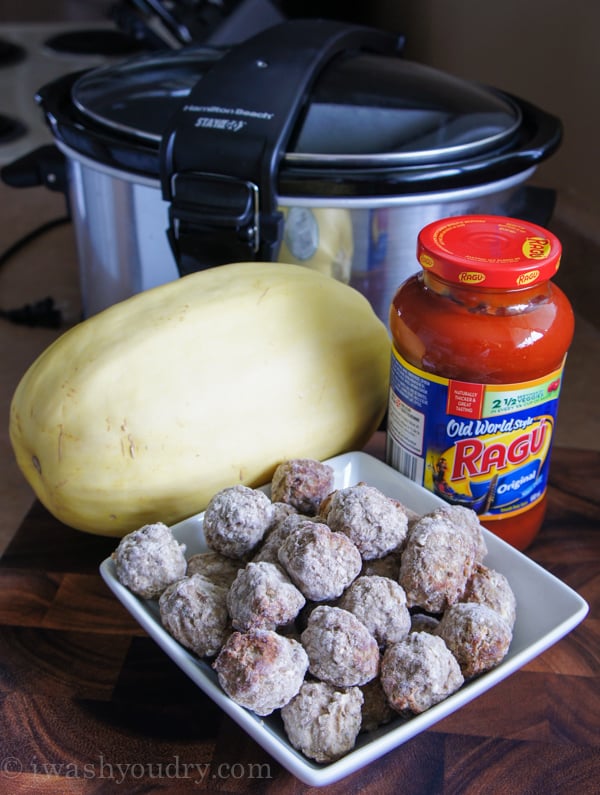 ingredients for spaghetti squash on wooden surface.