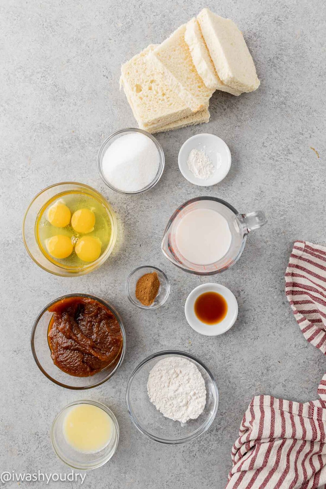 Ingredients for pumpkin french toast on gray surface.