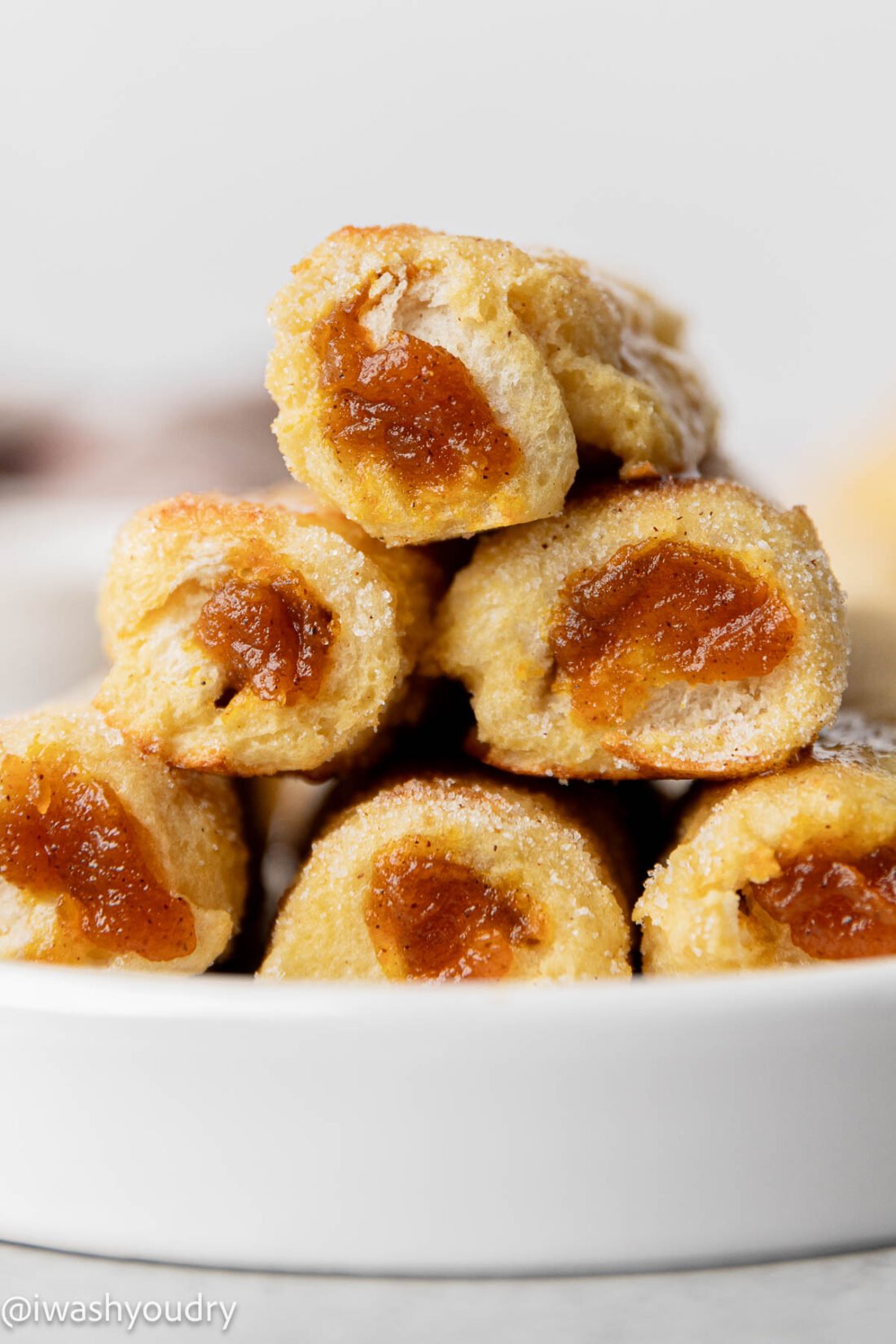 stack of french toast on white plate.