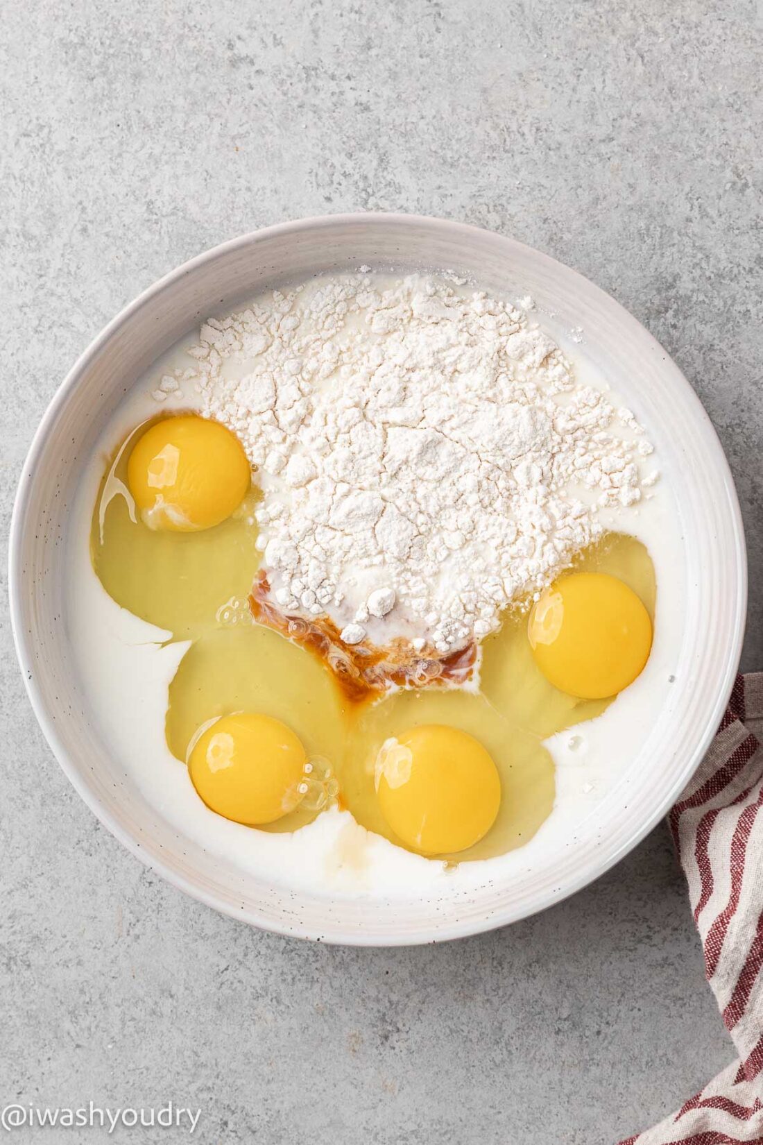 ingredients for french toast batter in white bowl.