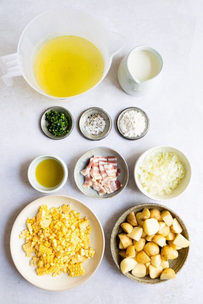 ingredients for chowder on white table