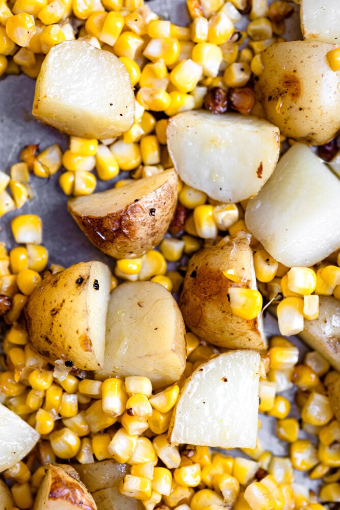 roasted corn and potatoes on pan