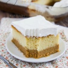 A slice of layered pumpkin cake topped with frosting titled, "Pumpkin Magic Cake"