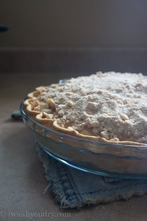 A close up of a baked Apple Pie Streusel Cake in a glass pie pan