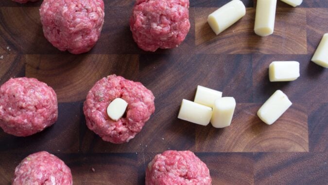 Stuffing meatballs with cheese