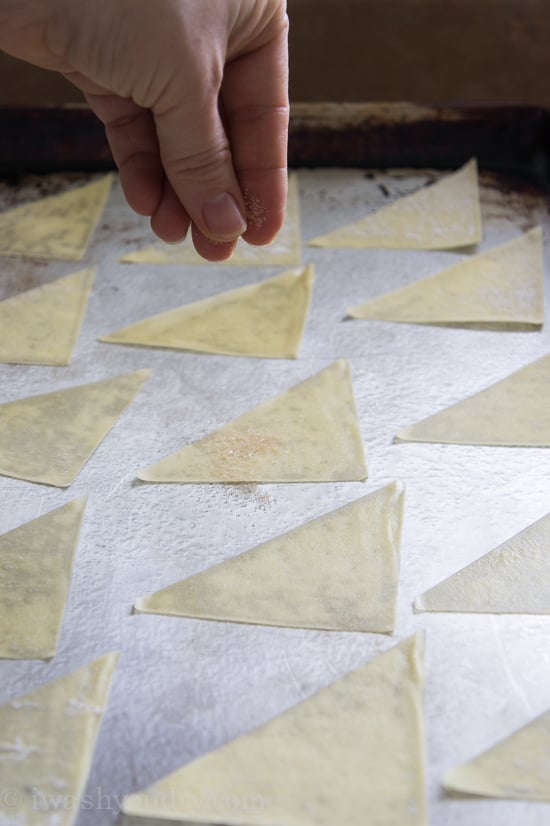 A pan with triangle slices of dough on it