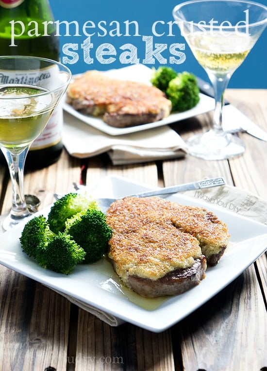 Two Plates on a table with Parmesan Crusted Steak and a side of broccoli