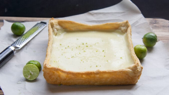 A close up of plain baked crust for the Key Lime Pie Cheesecake Bars