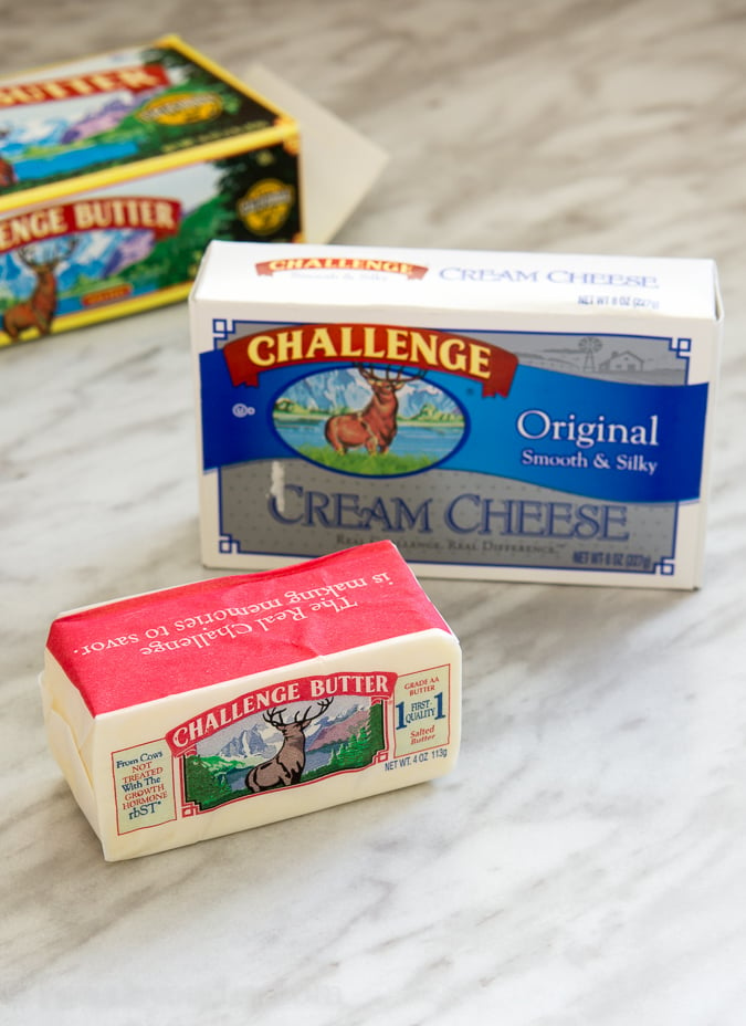 ingredients for alfredo sauce on white surface.