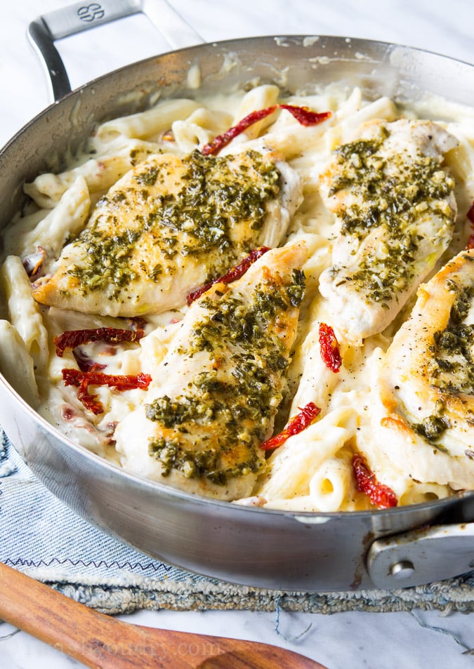 Basil Pesto Chicken with Alfredo Penne and Sun Dried Tomatoes! This is a one skillet dish that's ready in about 20 minutes!! My family absolutely loved this one!