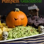 Frightfully Delicious Pumpkin Guacamole! Such a fun way to serve the guacamole for Halloween!