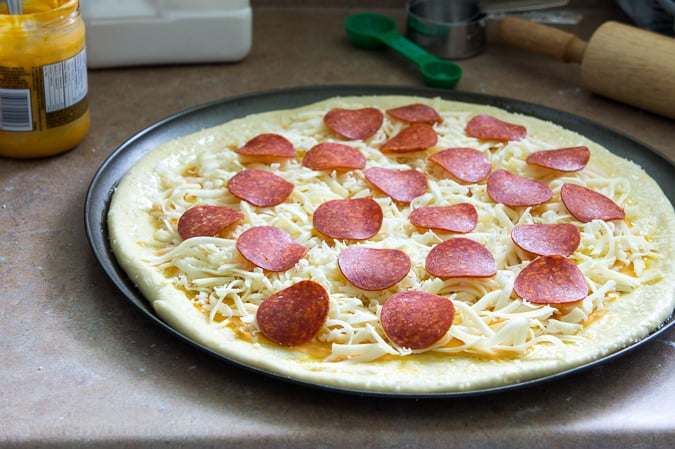 Pretzel Pizza!! The crust is made of soft pretzel dough, and then it's topped with nacho cheese sauce and the classic pepperoni and cheese toppings. It's out of this world!