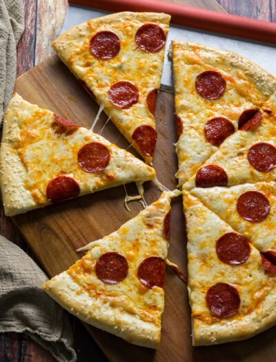 Pretzel Pizza!! The crust is made of soft pretzel dough, and then it's topped with nacho cheese sauce and the classic pepperoni and cheese toppings. It's out of this world!