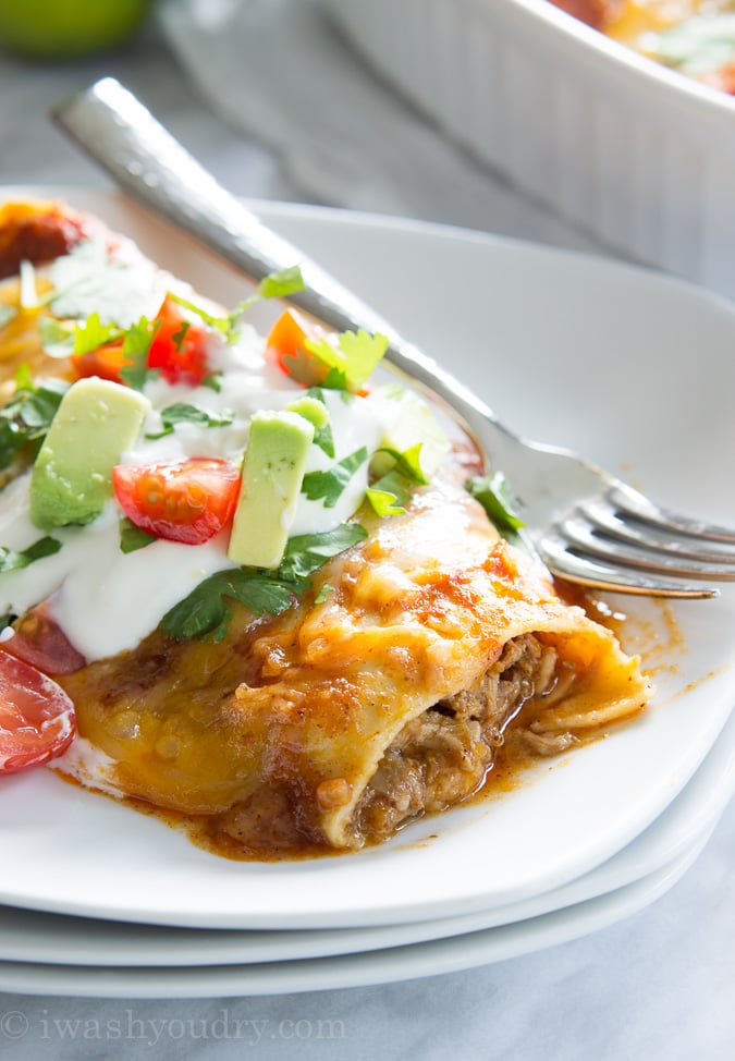 Sweet Pulled Pork Enchiladas with homemade enchilada sauce… these are to die for!! 