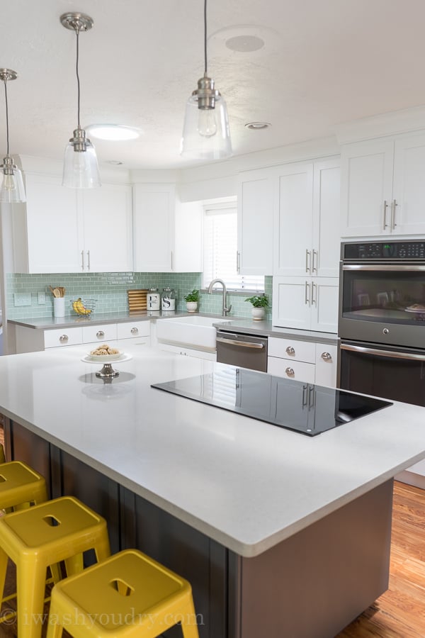 This is the most gorgeous white kitchen ever! That induction cooktop with telescopic downdraft system from GE is so neat! 