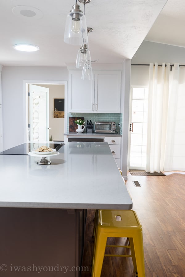 Love this Kitchen transformation! The pendant lights are simply gorgeous! 