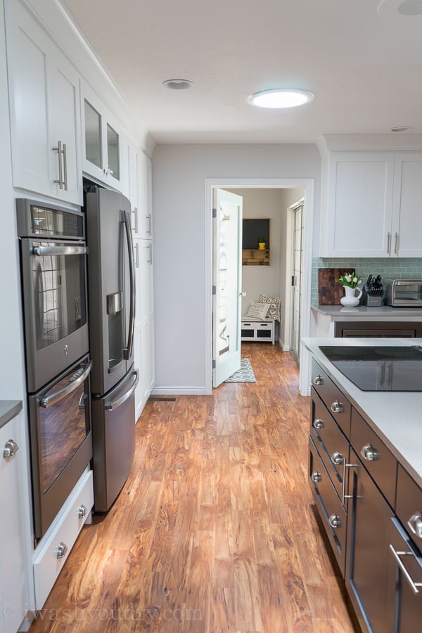 Love the natural light in this kitchen, and that Laundry Room door is stunning! 