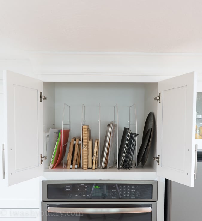 Use a rack to store cutting boards, cookie sheets and pizza pans to easily access!