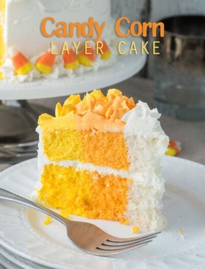 A slice of cake on a plate with yellow, orange and white layers