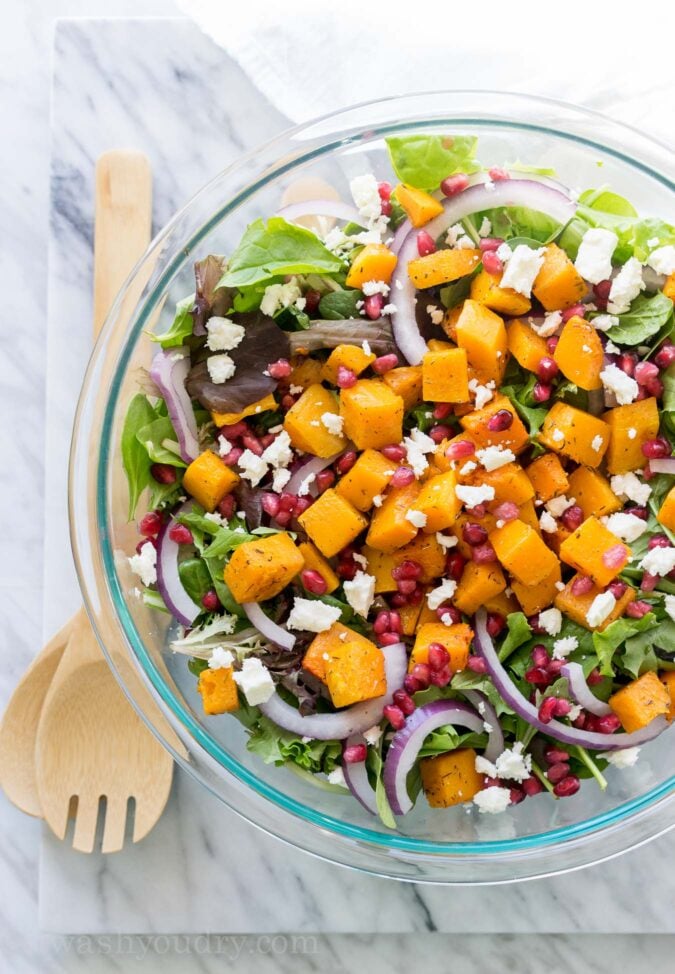 This super easy Butternut Squash Fall Salad is filled with pomegranate, feta cheese, purple onion and roasted butternut squash! It's such a great salad recipe to have on hand! 